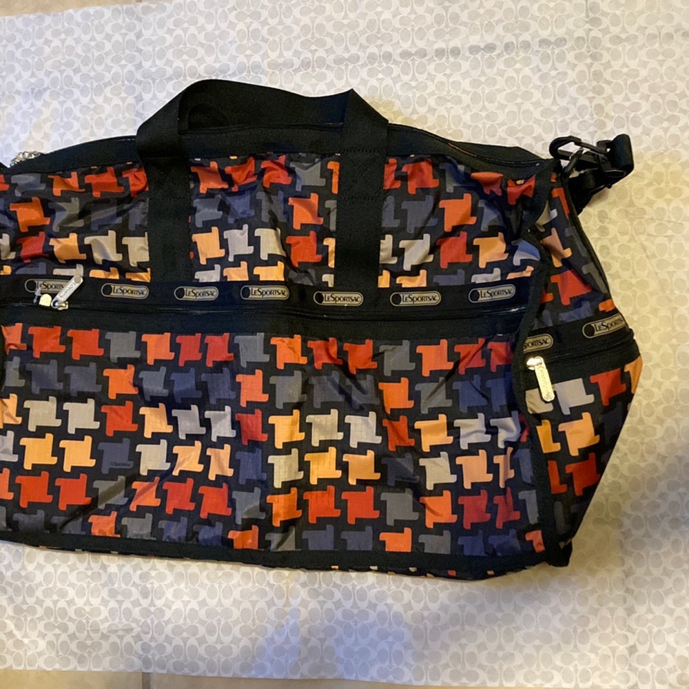 LeSportsac 20x12x10” large duffel bag with strap. multiple colors